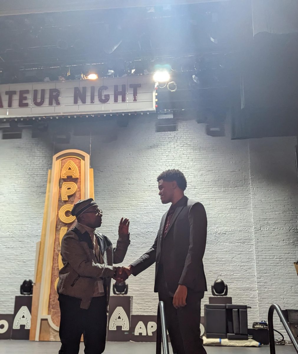 Lenny Gomez shakes hands with the legendary Mr. Apollo at the Apollo Theater. 